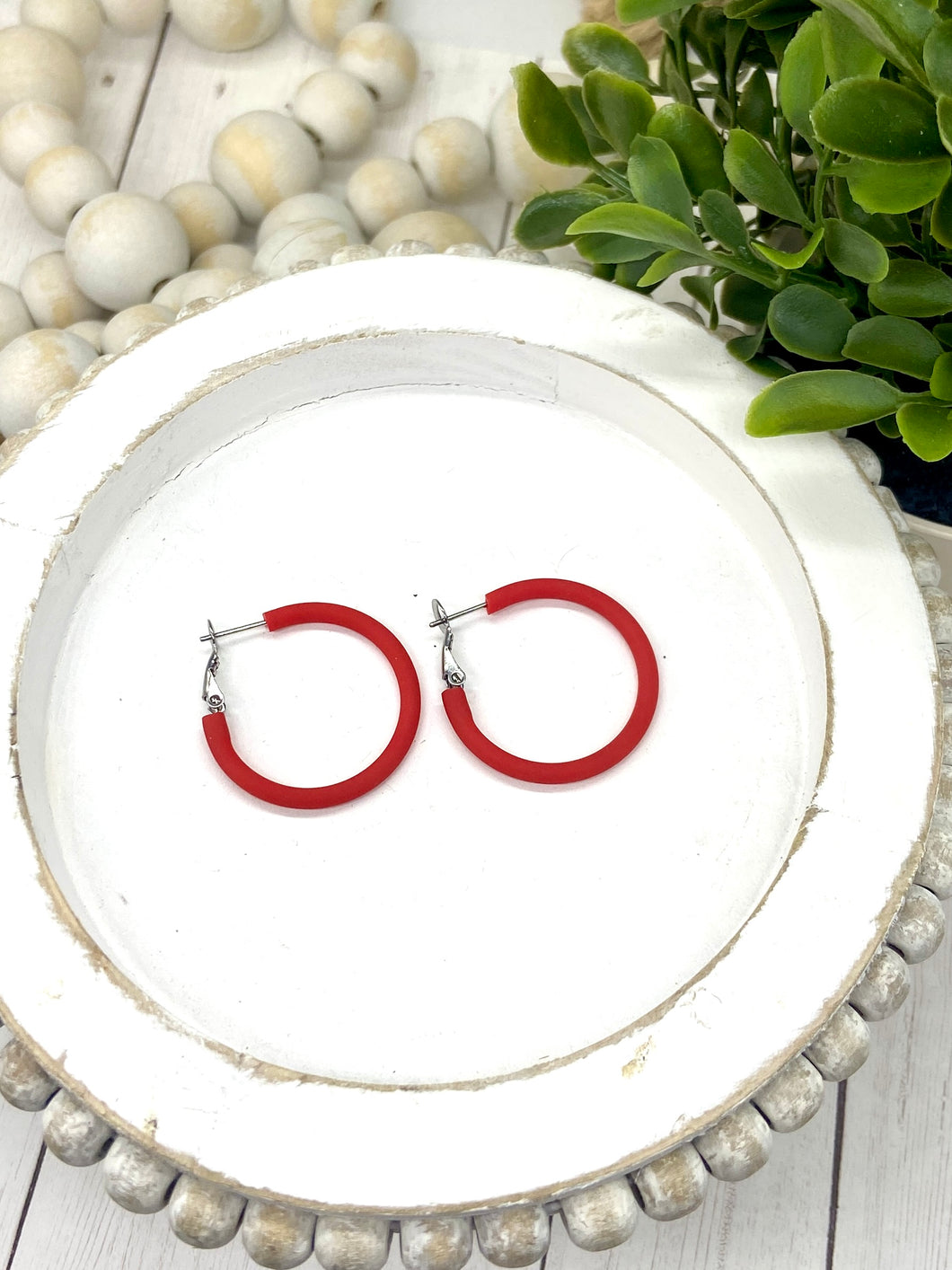 Red hoop earrings